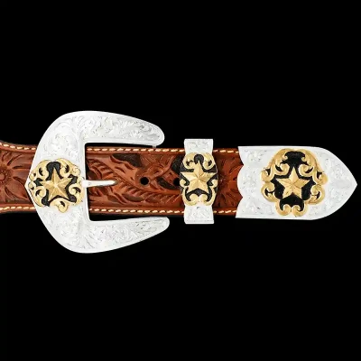A custom western three piece belt buckle set featuring three golden star figures 